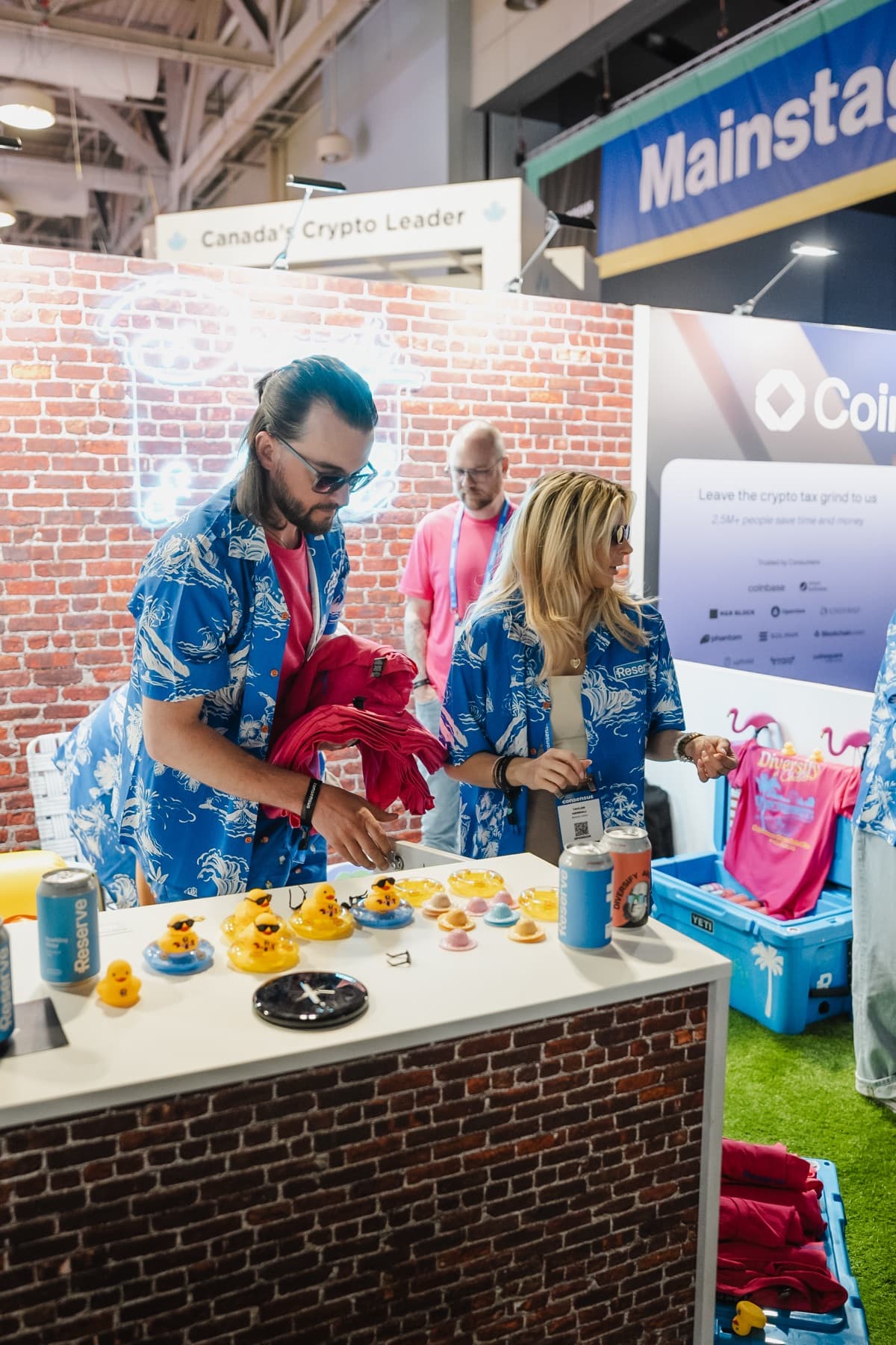 Rubber ducks and custom cans on the booth counter